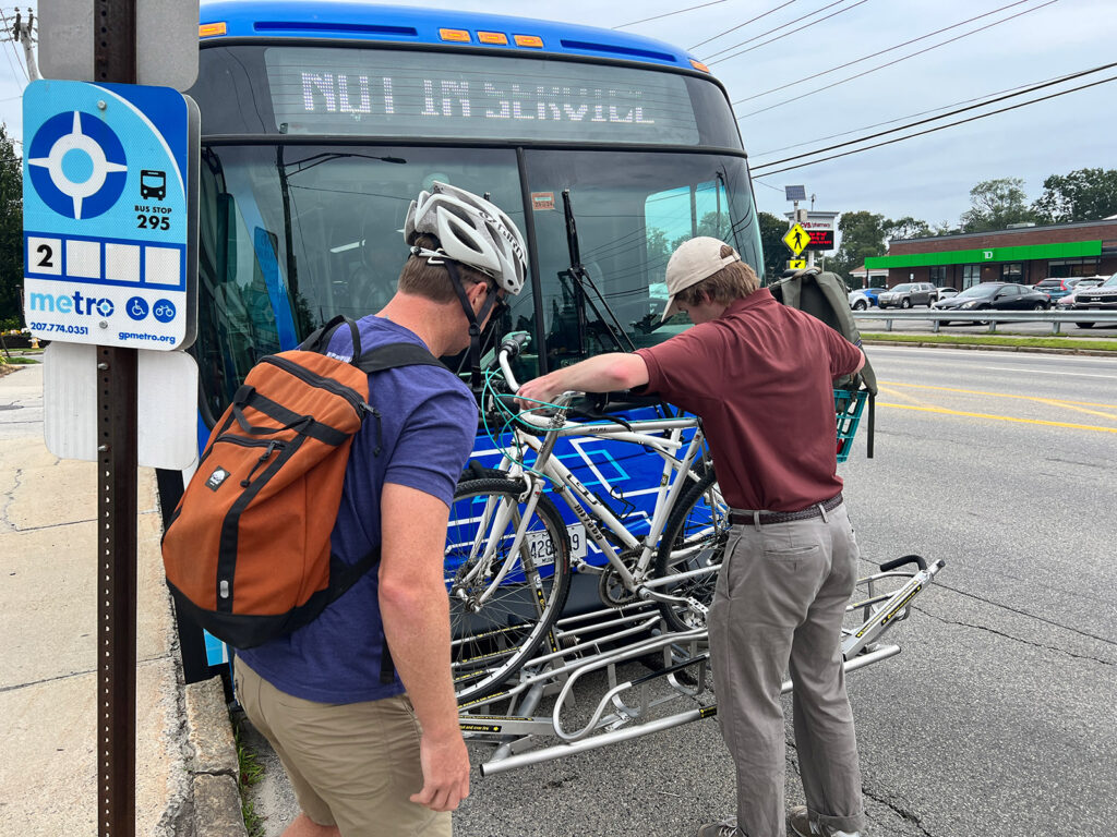 person putting bike on rack