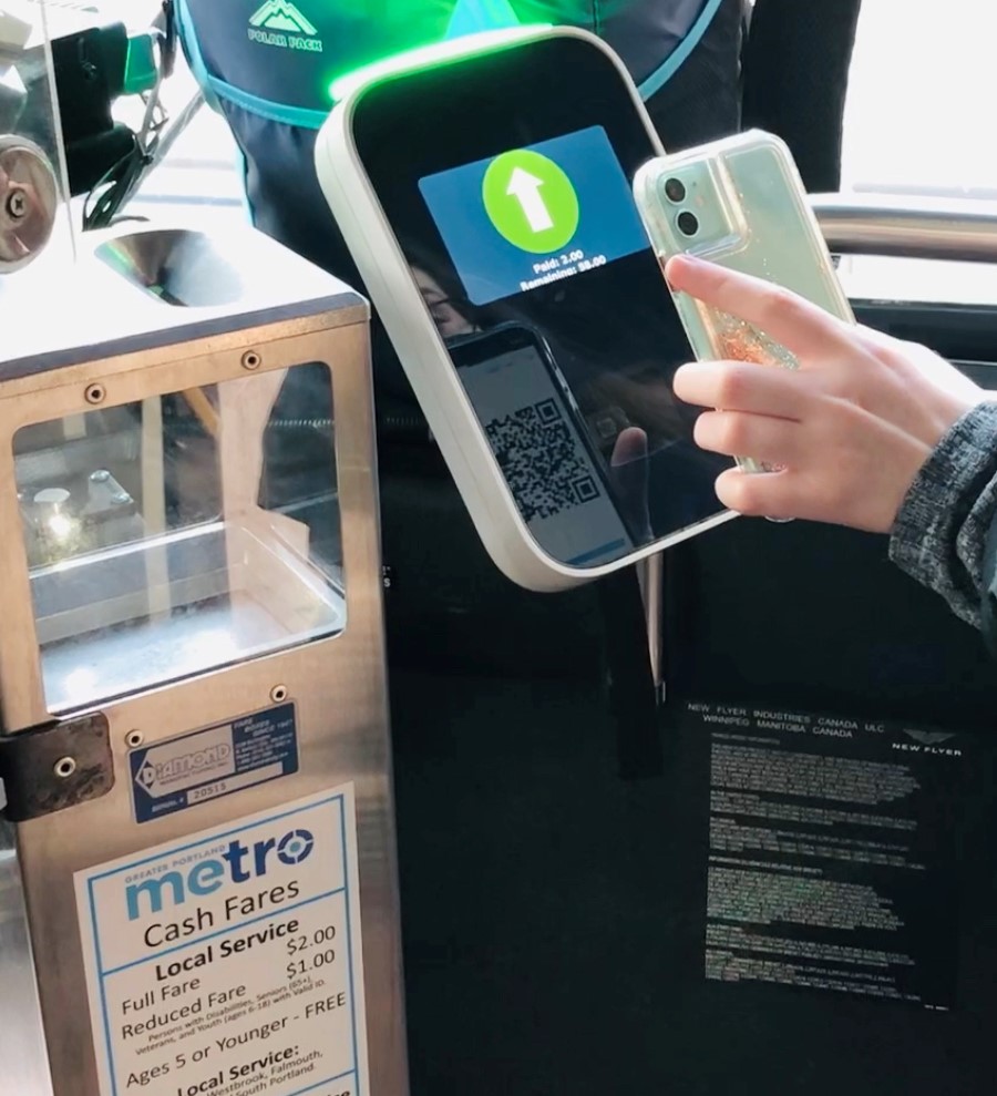 phone app held up to the dirigo kiosk