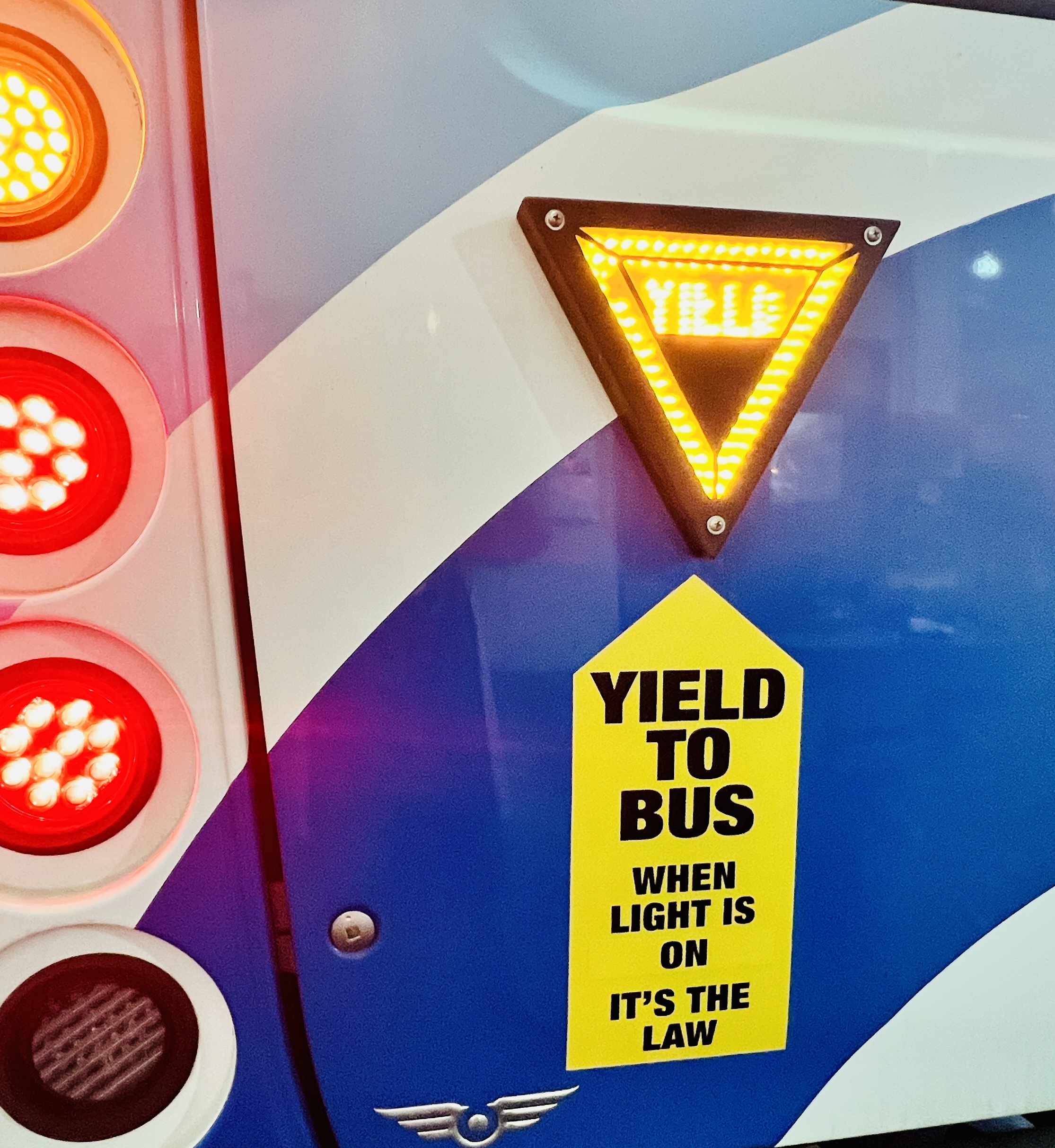 yield to bus on back of bus